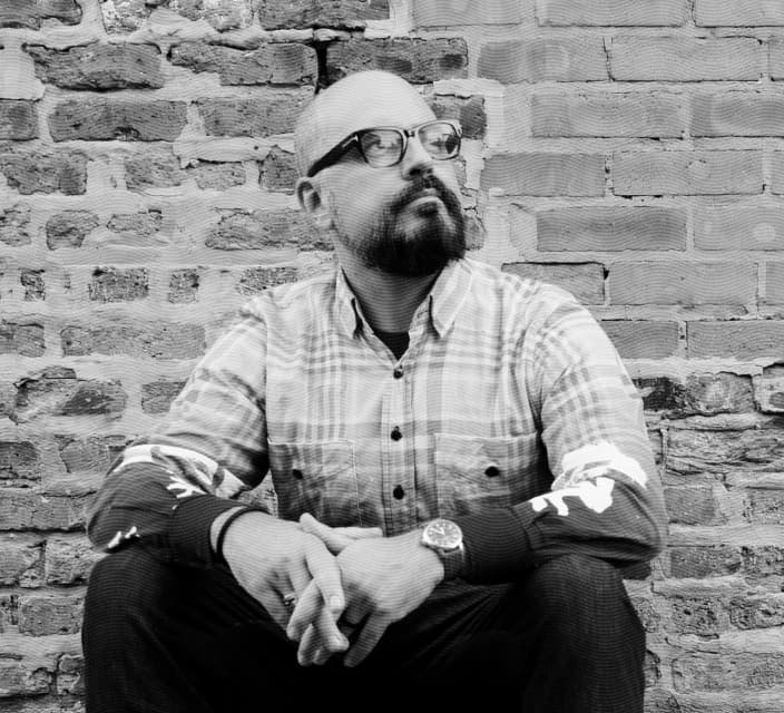 Black and white portrait photograph of Kieran Ots, founder of Make No Small Things